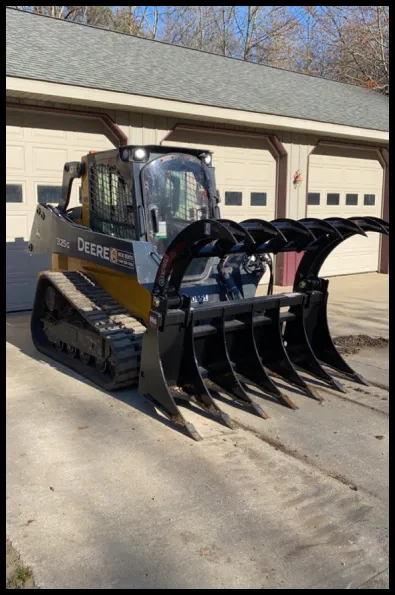 SkidSteer with the claw/grapple attachement